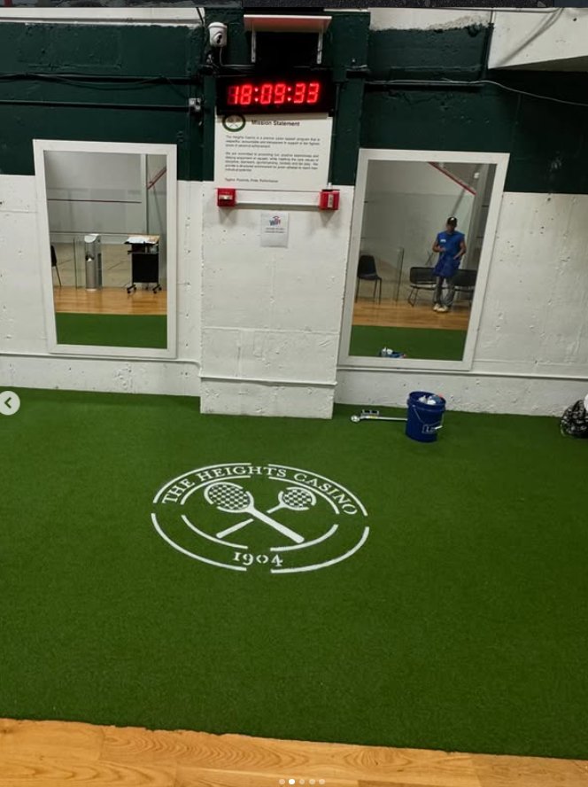 Indoor gym turf close-up with Heights Casino logo