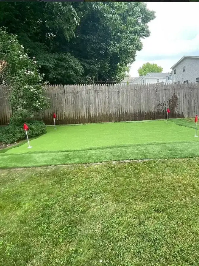 Backyard putting green with synthetic turf by Turf Boss Construction NJ