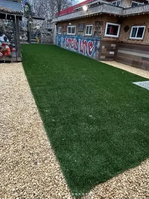 Custom synthetic turf dog run installation